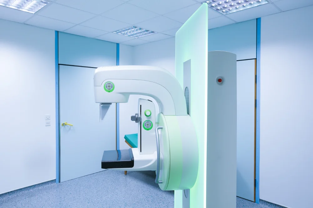Modern CT scanner in hospital room.