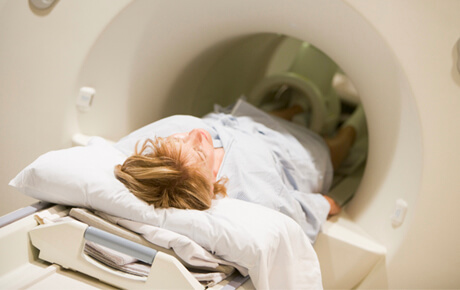 Patient undergoing MRI scan in hospital.